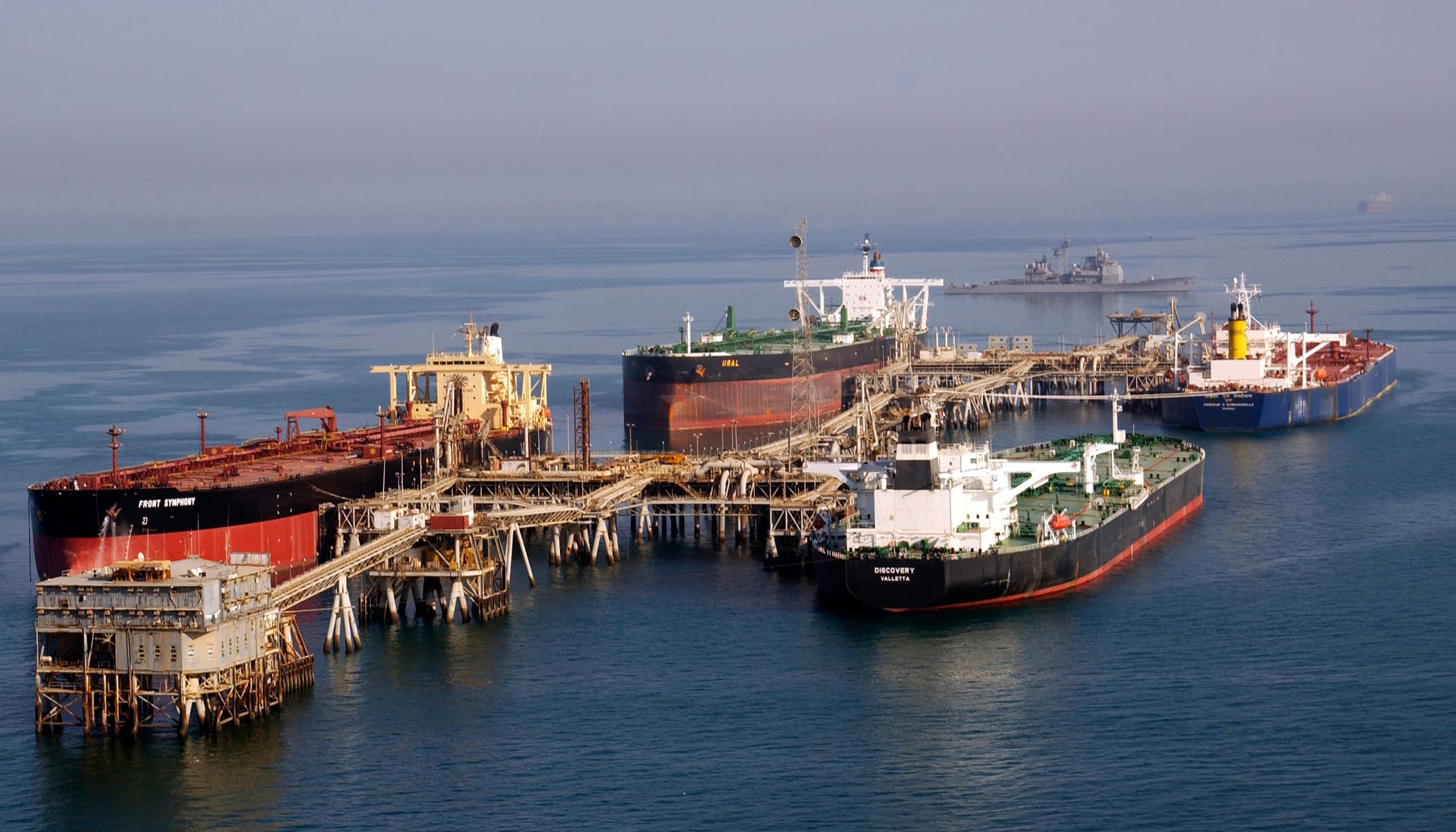 Oil jetty at dusk overlooking shipping lanes
