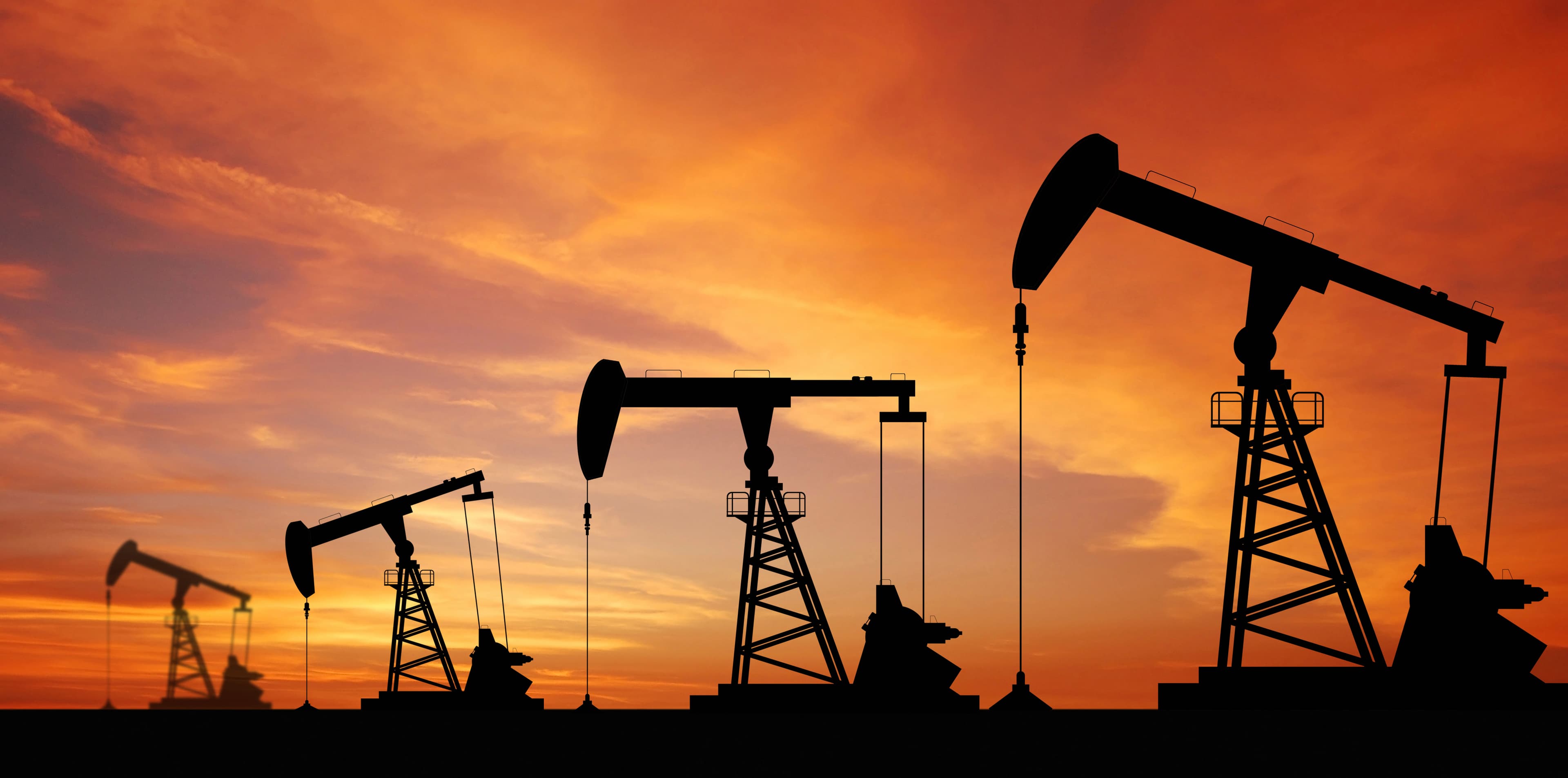 Oilfield at dusk representing energy products